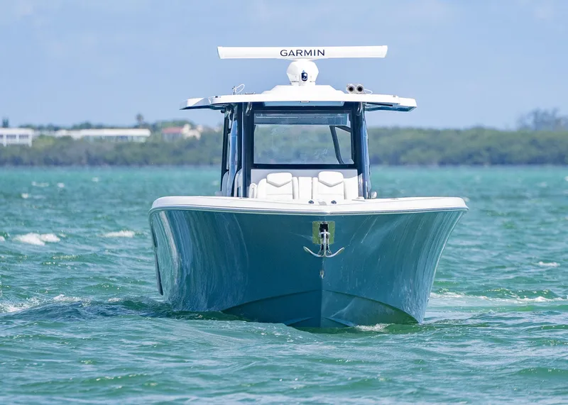 Slide: The Image of 2025 Invincible 43 Open Fisherman boat on water, front view. - 41