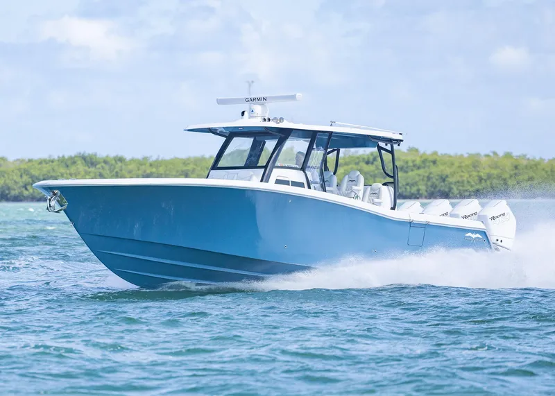 Slide: The Image of 2025 Invincible 43 Open Fisherman boat cruising on blue water. - 43