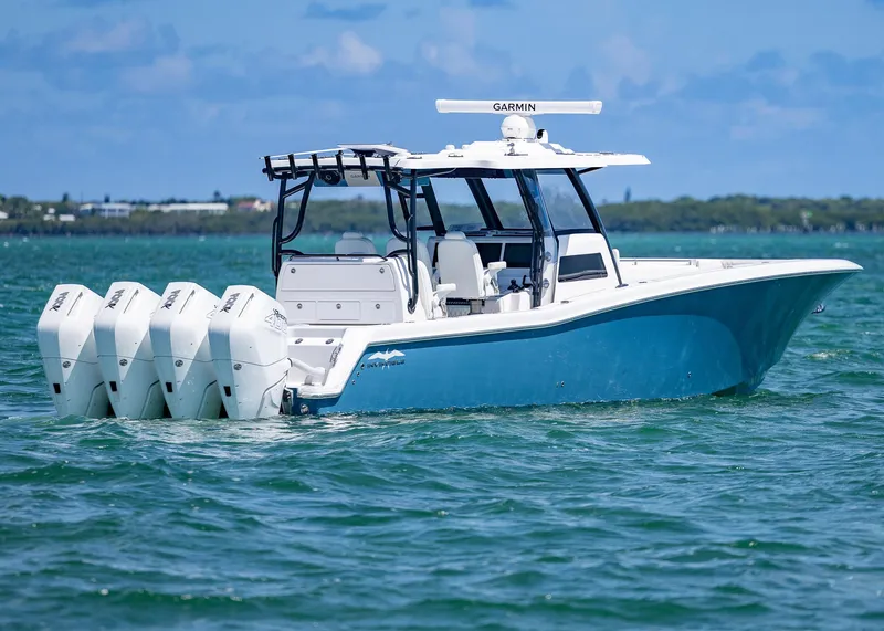 Slide: The Image of 2025 Invincible 43 Open Fisherman boat with four engines on the water. - 6