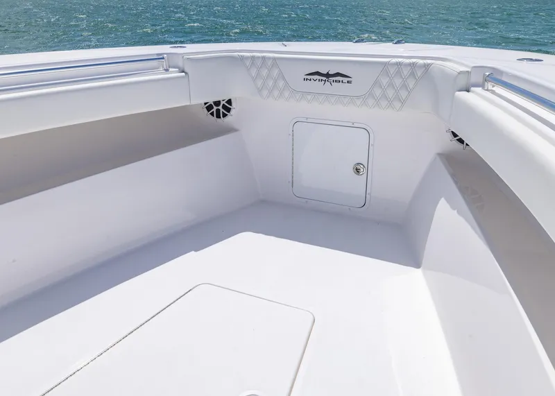 Slide: The Image of 2025 Invincible 43 Open Fisherman boat interior with storage compartment and sleek design. - 8