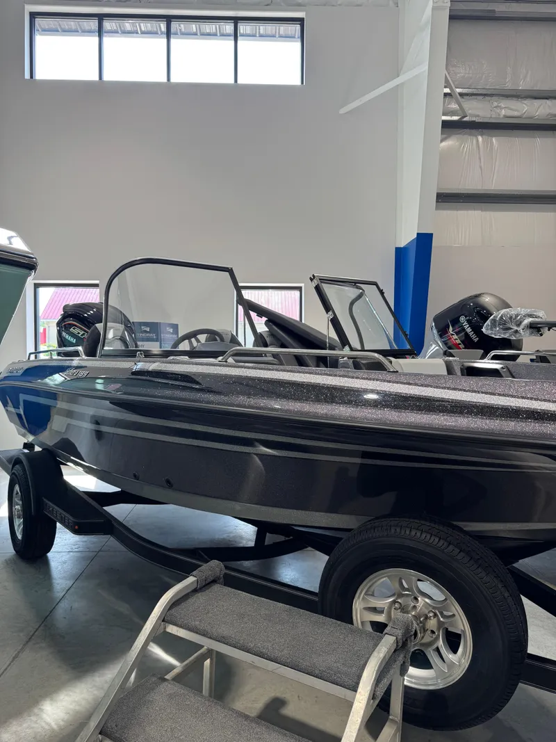 Slide: The Image of 2025 Skeeter Solera 189 boat displayed indoors on a trailer. - 11