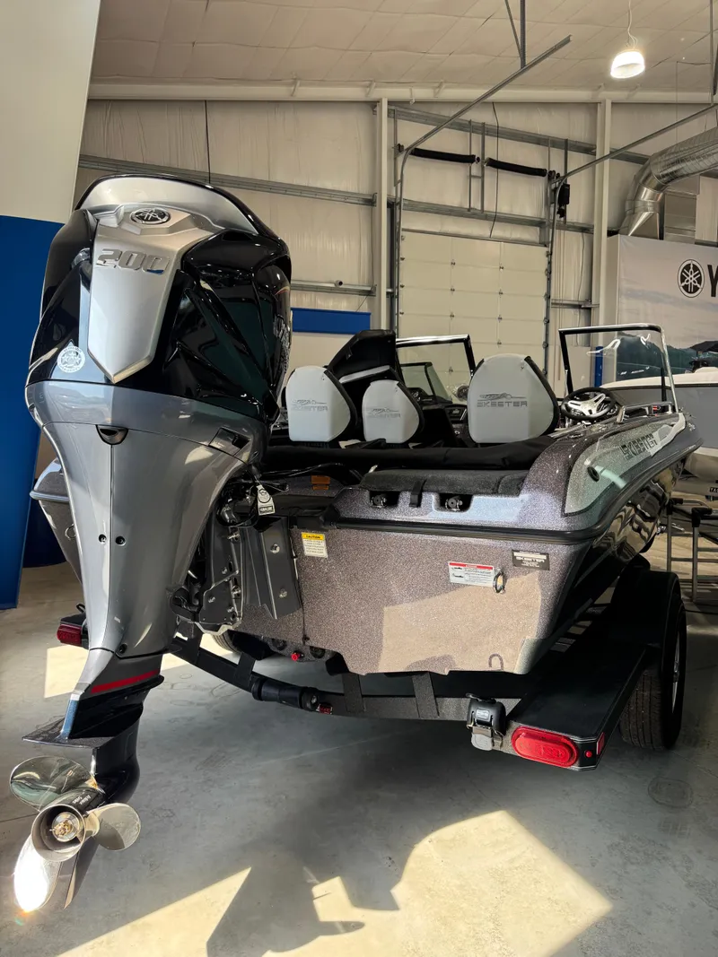 Slide: The Image of 2025 Skeeter Solera 189 boat with powerful outboard motor in showroom. - 13