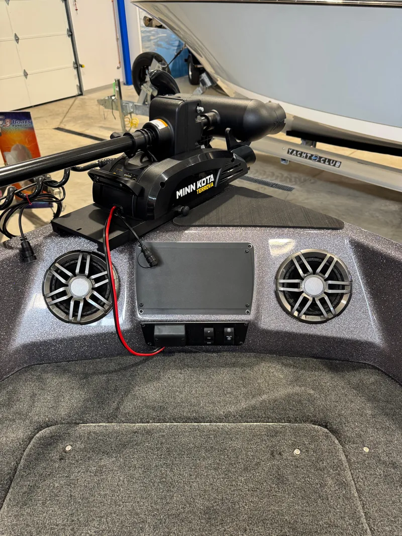 Slide: The Image of 2025 Skeeter Solera 189 boat dashboard with Minn Kota trolling motor and speakers. - 14