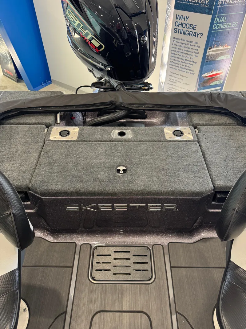 Slide: The Image of 2025 Skeeter Solera 189 boat interior with Yamaha engine, showcasing seating and storage. - 26