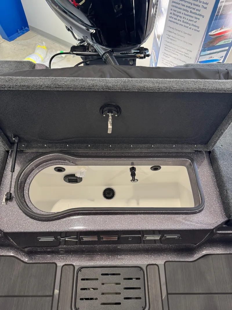 Slide: The Image of 2025 Skeeter Solera 189 boat livewell with open lid, showcasing interior features. - 27