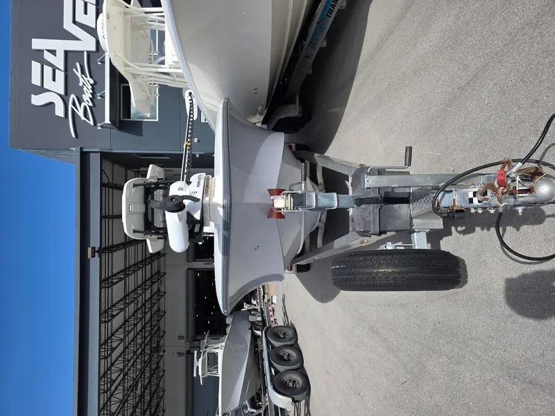 Slide: The Image of 2023 SeaVee 270Z boat on trailer outside SeaVee Boats facility. - 3