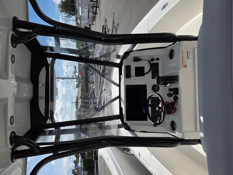 Slide: The Image of 2023 SeaVee 270Z boat console with steering wheel and navigation equipment. - 5