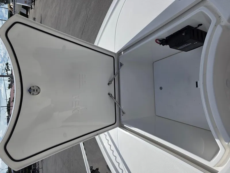 Slide: The Image of Open storage compartment on 2023 SeaVee 270Z boat, showcasing interior space. - 6