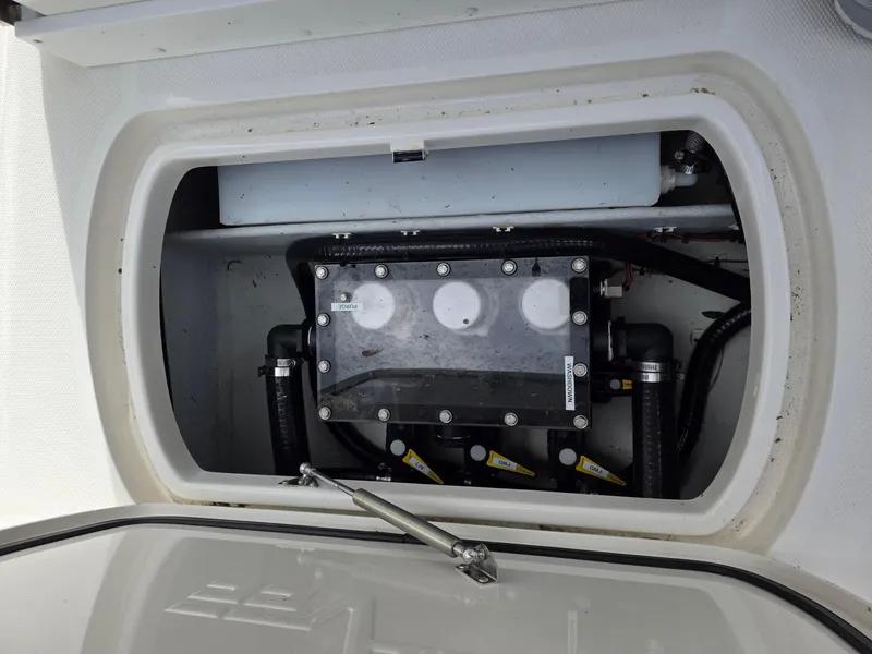 Slide: The Image of 2023 SeaVee 270Z boat compartment showcasing internal components and wiring. - 8