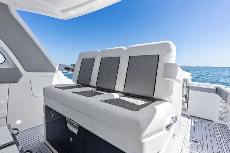 Slide: The Image of Luxury seating on 2026 Everglades 367 CX boat, featuring elegant design and ocean view. - 26