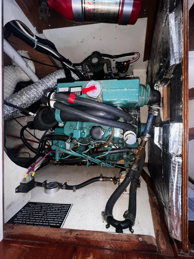 Slide: The Image of Engine compartment of a 1980 Pearson 32 sailboat with visible fire extinguisher. - 19