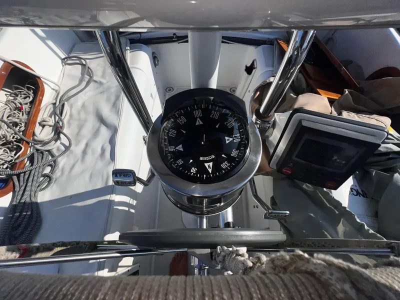 Slide: The Image of Cockpit view of a 1980 Pearson 32 sailboat with compass and navigation equipment. - 21