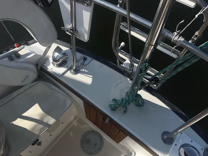 Slide: The Image of Cockpit view of a 1980 Pearson 32 sailboat with seating and rigging. - 25