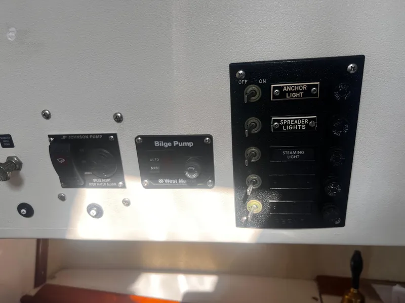 Slide: The Image of Control panel of a 1980 Pearson 32 boat with bilge and light switches. - 27