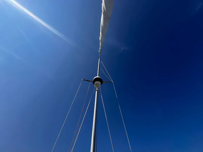Slide: The Image of Mast of 1980 Pearson 32 sailboat against clear blue sky. - 5