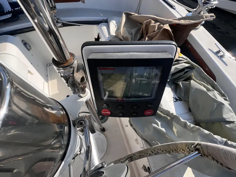 Slide: The Image of Cockpit of 1980 Pearson 32 sailboat with navigation equipment and folded sail. - 9