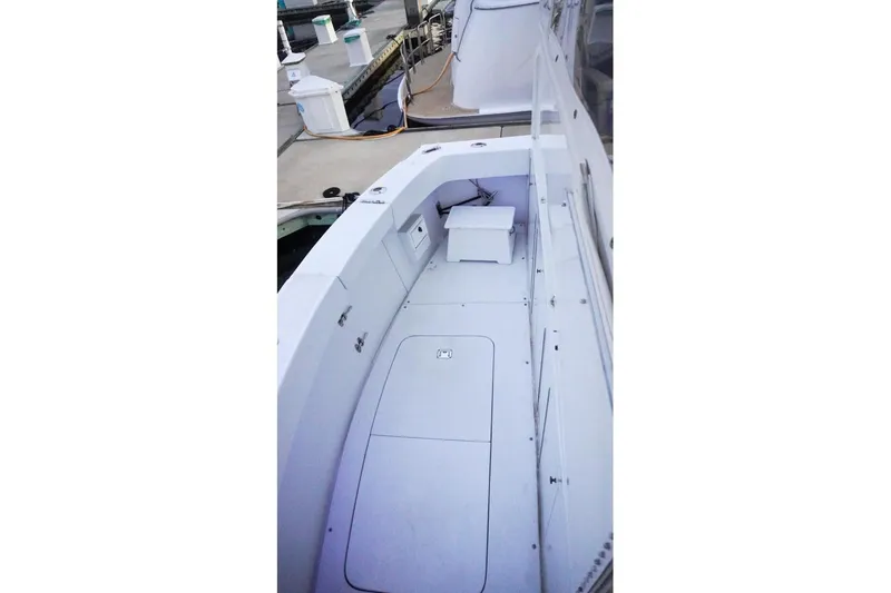 Slide: The Image of 1990 Hatteras 62 Cockpit Motor Yacht deck view at marina. - 14
