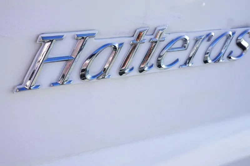 Slide: The Image of Chrome "Hatteras" logo on a 1990 Hatteras 62 Cockpit Motor Yacht. - 15