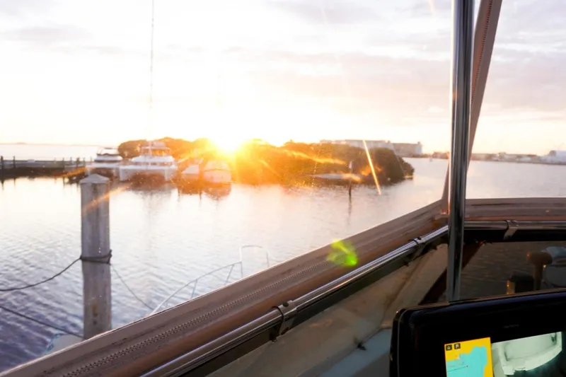 Slide: The Image of Sunset view from 1990 Hatteras 62 Cockpit Motor Yacht, overlooking marina. - 24