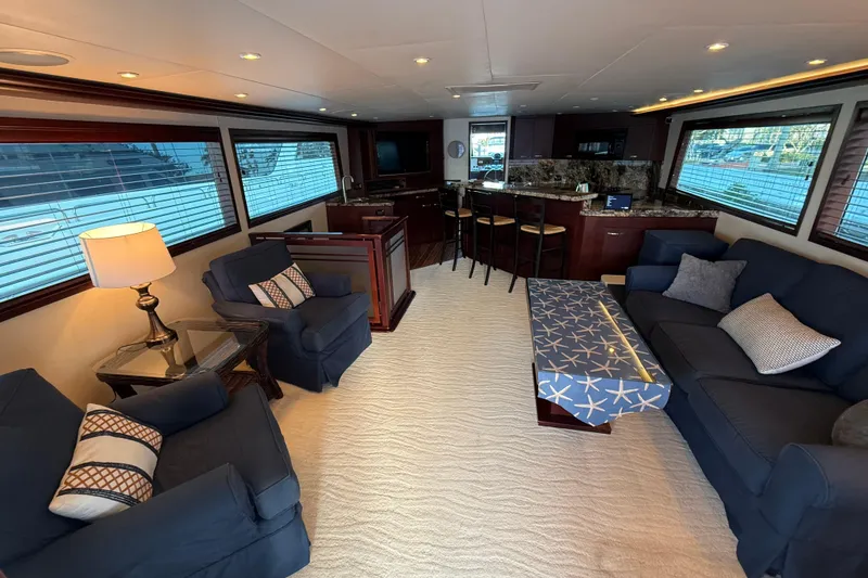 Slide: The Image of Luxurious interior of 1990 Hatteras 62 Cockpit Motor Yacht with elegant seating and modern decor. - 28