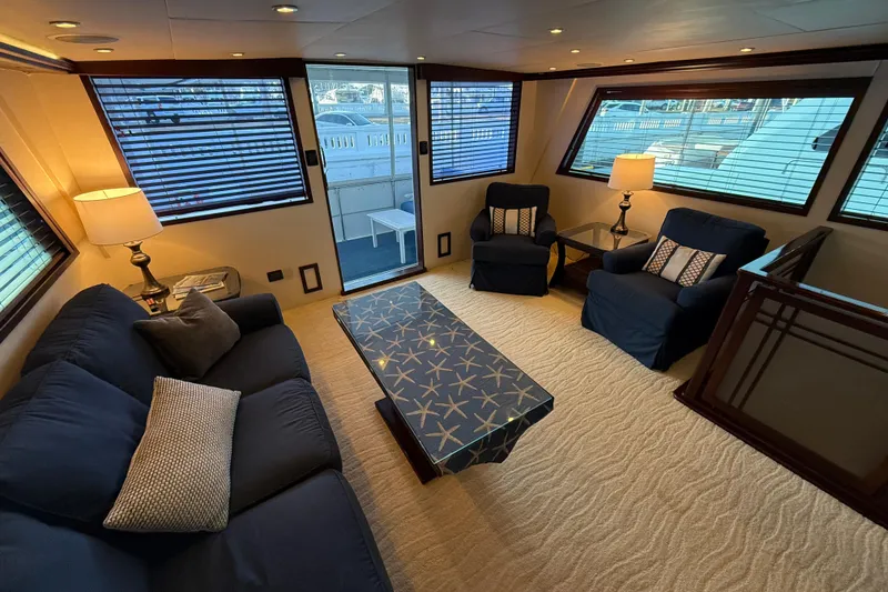 Slide: The Image of Luxurious interior of 1990 Hatteras 62 Cockpit Motor Yacht with elegant seating and decor. - 29
