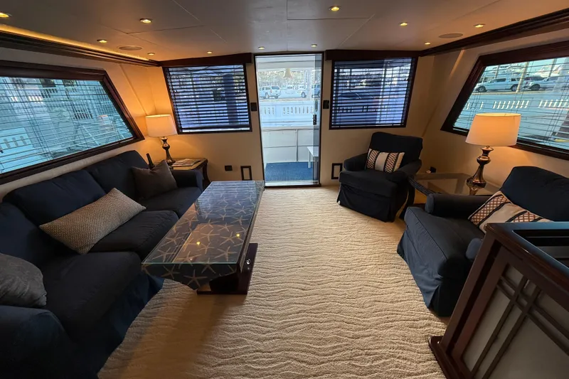 Slide: The Image of Luxurious interior of 1990 Hatteras 62 Cockpit Motor Yacht with elegant seating and decor. - 30