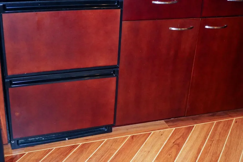 Slide: The Image of Wooden cabinetry and flooring in 1990 Hatteras 62 Cockpit Motor Yacht interior. - 35