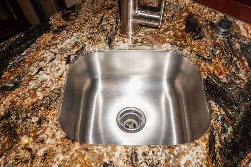 Slide: The Image of Stainless steel sink on granite countertop in 1990 Hatteras 62 Cockpit Motor Yacht. - 41