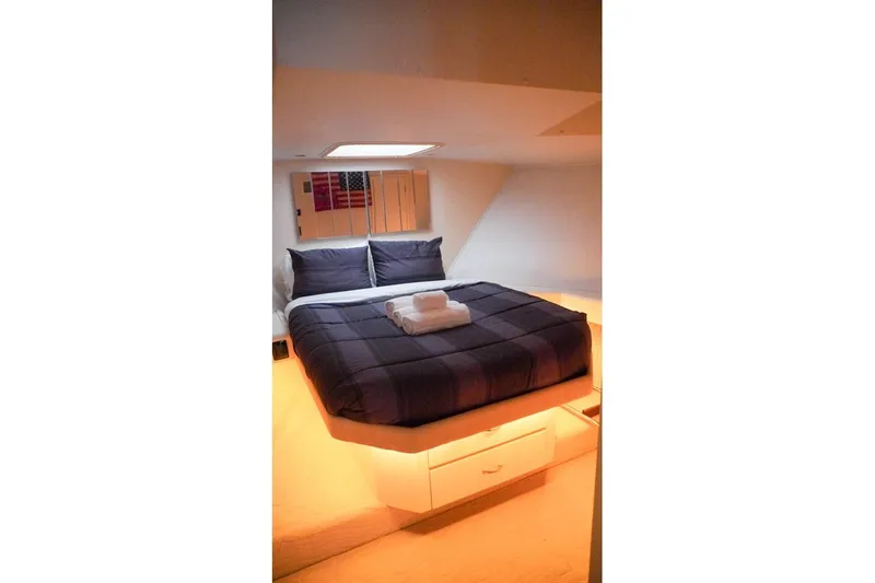 Slide: The Image of Cozy bedroom interior of 1990 Hatteras 62 Cockpit Motor Yacht with modern bedding. - 43