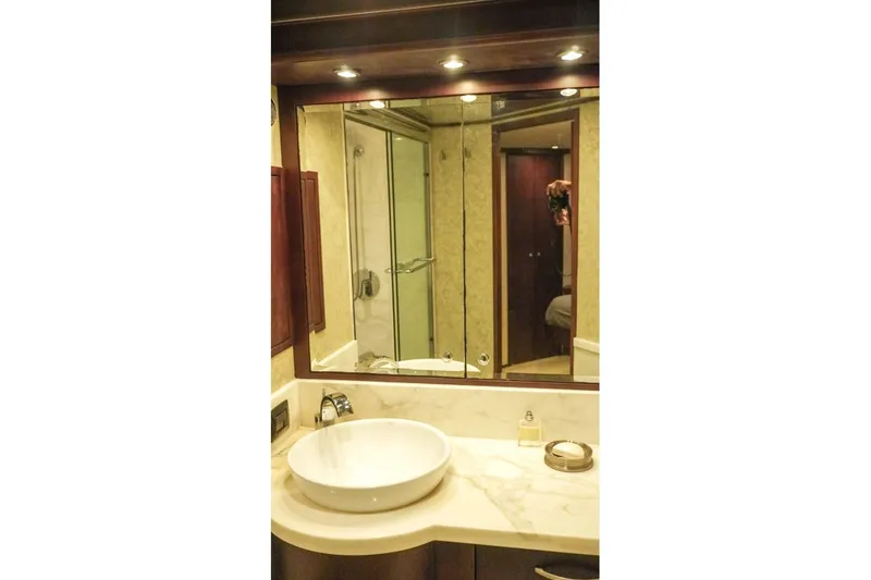 Slide: The Image of Luxurious bathroom interior of 1990 Hatteras 62 Cockpit Motor Yacht with modern fixtures. - 53