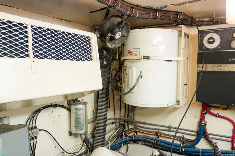 Slide: The Image of Engine room of 1990 Hatteras 62 Cockpit Motor Yacht with wiring and equipment. - 63