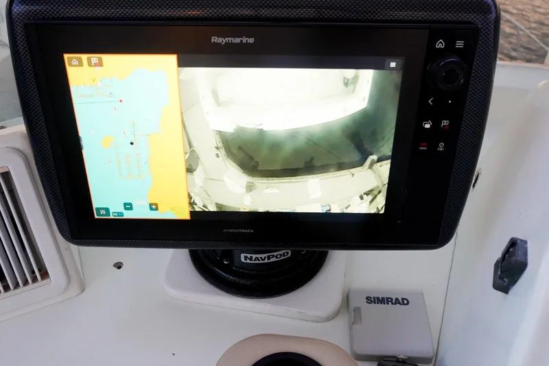 Slide: The Image of Raymarine navigation display on 1990 Hatteras 62 Cockpit Motor Yacht dashboard. - 77