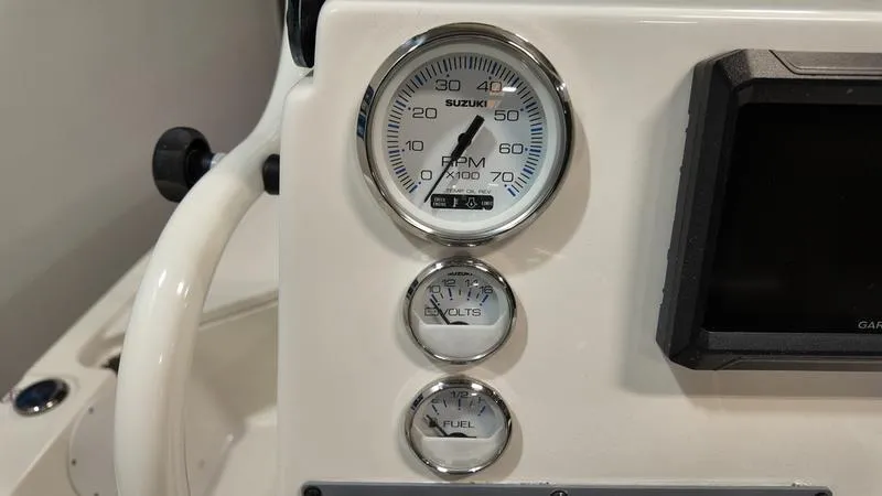 Slide: The Image of Dashboard of 2025 Sea Born FX 21 BAY boat with gauges and display. - 11