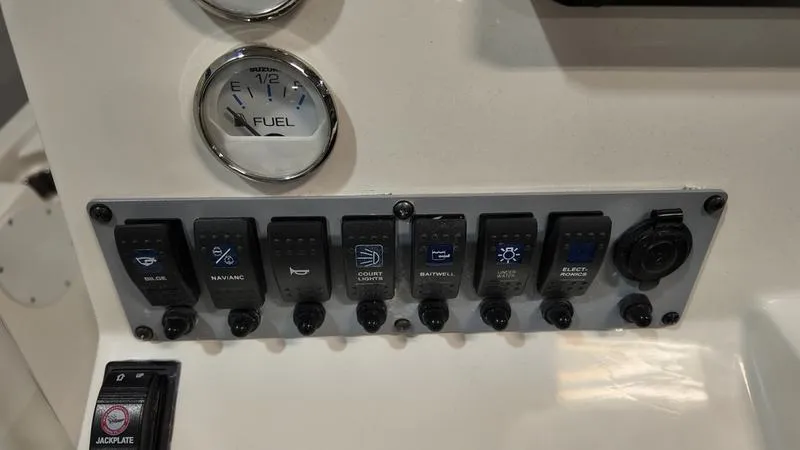 Slide: The Image of Control panel of 2025 Sea Born FX 21 BAY boat with fuel gauge and switches. - 13