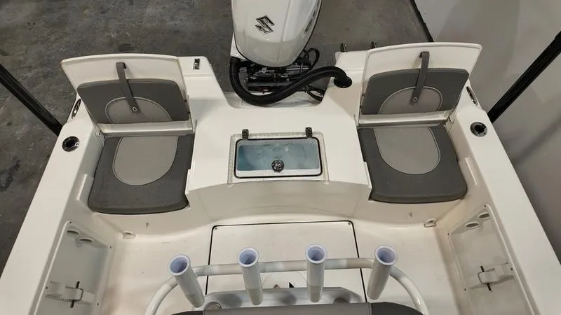 Slide: The Image of 2025 Sea Born FX 21 BAY boat interior with seating and motor. - 4