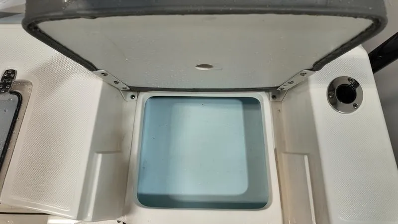 Slide: The Image of Open storage compartment on 2025 Sea Born FX 21 BAY boat. - 5