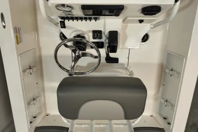Slide: The Image of 2025 Sea Born FX 21 BAY boat console with steering wheel and controls. - 9