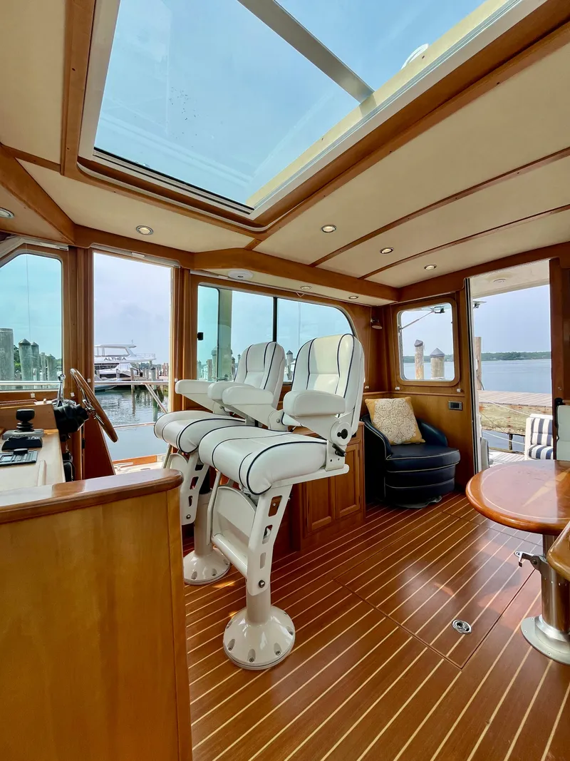 Slide: The Image of Luxurious interior of 2010 Sabre 40 Sedan yacht with skylight and elegant seating. - 17
