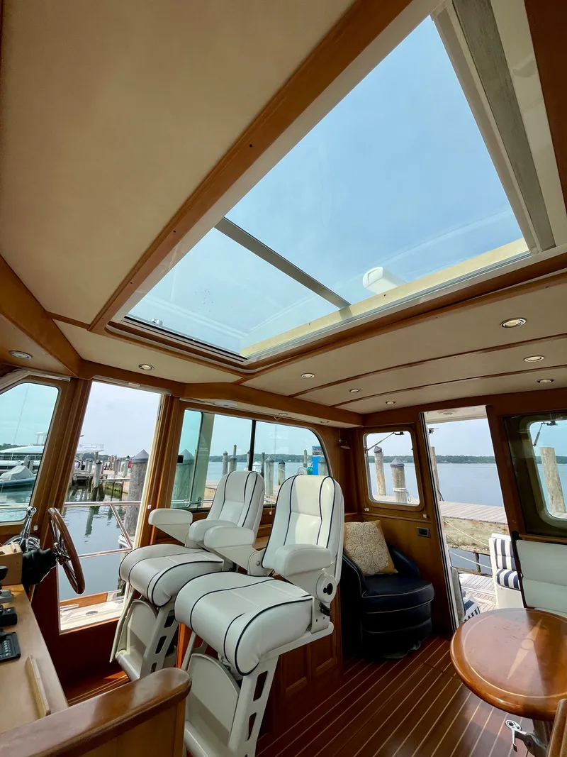 Slide: The Image of Interior of 2010 Sabre 40 Sedan yacht with skylight and luxurious seating. - 23