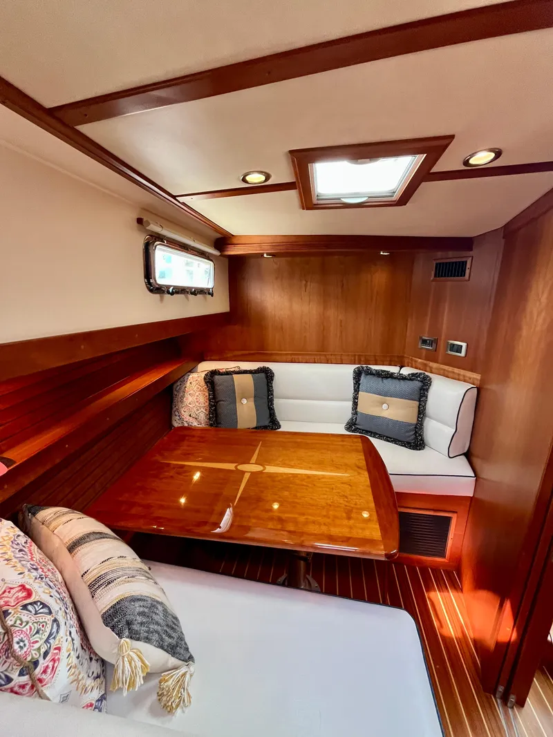 Slide: The Image of Cozy interior of 2010 Sabre 40 Sedan with elegant wood finish and plush seating. - 27