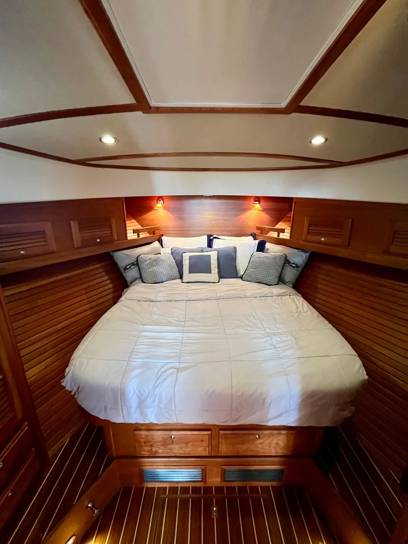 Slide: The Image of Luxurious cabin interior of 2010 Sabre 40 Sedan with cozy bed and elegant wood finish. - 29