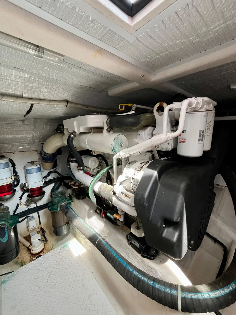 Slide: The Image of Engine room of a 2010 Sabre 40 Sedan yacht, showcasing mechanical components and systems. - 42