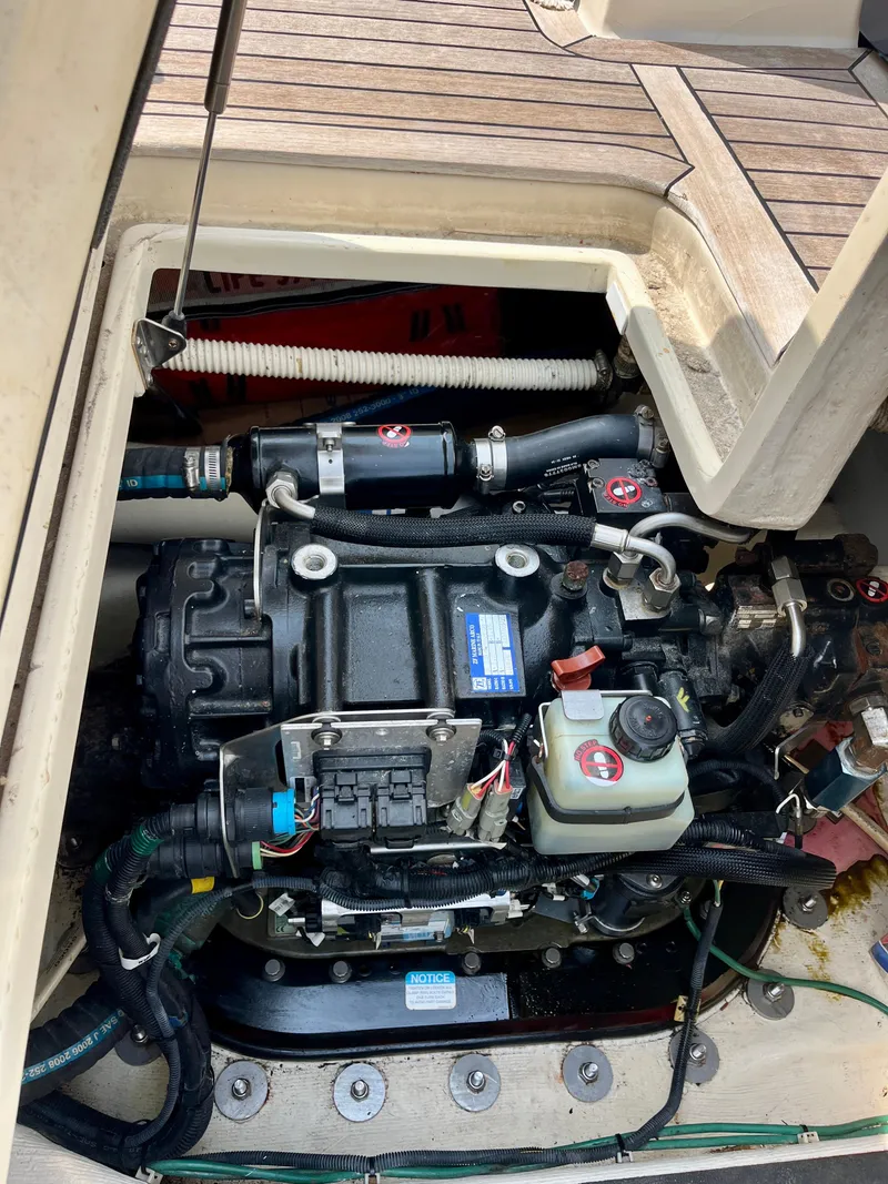Slide: The Image of Engine compartment of a 2010 Sabre 40 Sedan boat, showcasing mechanical components and wiring. - 44