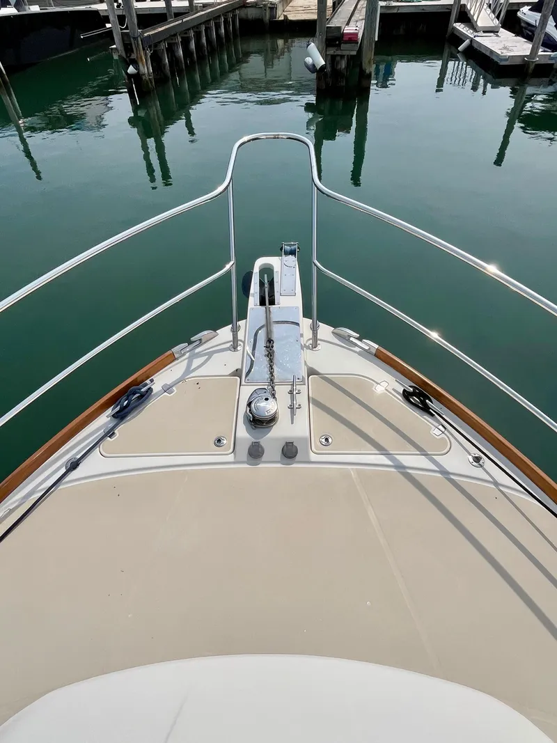 Slide: The Image of Bow view of 2010 Sabre 40 Sedan yacht docked in marina. - 49