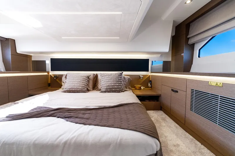 Slide: The Image of Luxurious cabin interior of 2020 Prestige 420 yacht with modern design and cozy bedding. - 35
