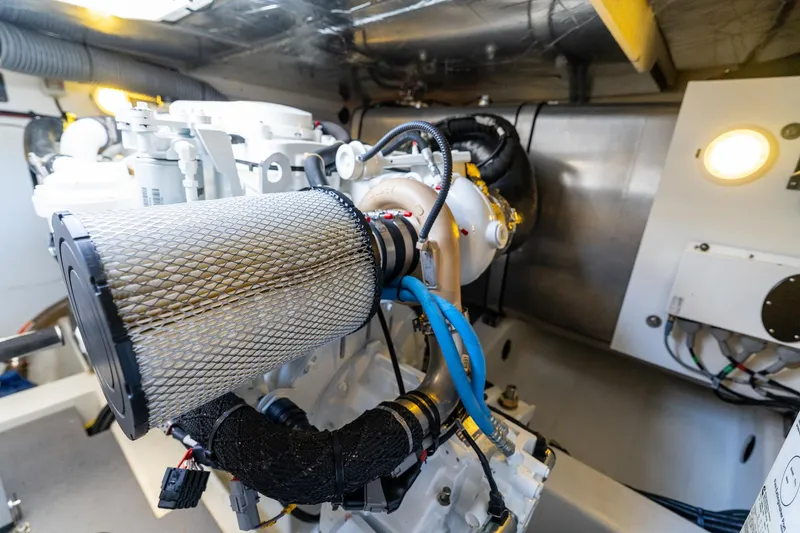 Slide: The Image of Engine room of 2020 Prestige 420 yacht, showcasing mechanical components and wiring. - 41