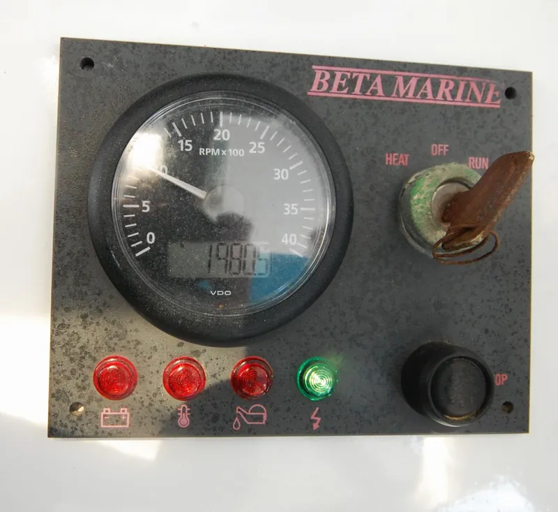 Slide: The Image of Control panel of a 2003 Leopard Morrelli & Melvin Catamaran with RPM gauge and indicator lights. - 13