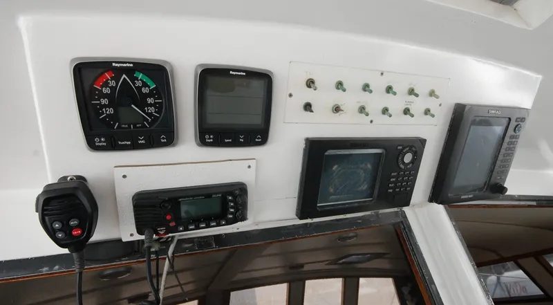 Slide: The Image of Control panel of a 2003 Custom Leopard Morrelli & Melvin Catamaran with navigation instruments. - 15