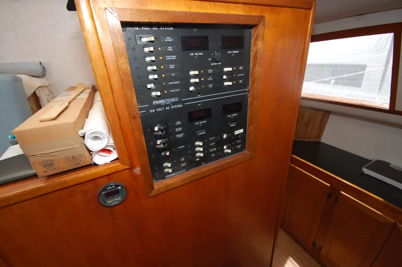Slide: The Image of Electrical panel on 2003 Leopard Morrelli & Melvin Catamaran, featuring AC and DC systems. - 16