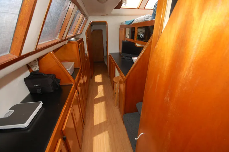 Slide: The Image of Interior of 2003 Leopard Morrelli & Melvin Catamaran with wooden cabinetry and natural light. - 18